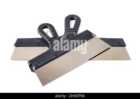Construction putty knifes of different sizes isolated on white Stock Photo