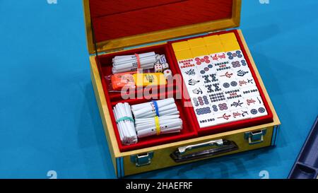 Mahjong board game set. An ancient Asian game called Mahjong as a way to have fun and have some fun. Stock Photo
