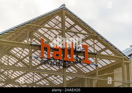 'Hall in one' is the name of the new shopping center and leisure area in Saint-Chamond, France. It was built in 2018 in the halls of the former local steel industry (Compagnie des forges et aciéries de la Marine et d'Homécourt). In the former industrial complex is the shopping mall 'Hall in 1' with cinema, brasseries, leisure and shopping facilities.