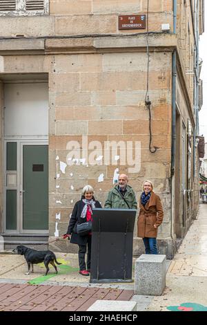 Angela Berg with Michel Bezacier and his wife at Place de Grevenbroich in downtown Saint Chamond, France. Grevenbroich, in Germany and Saint-Chamond in France are twin towns Stock Photo