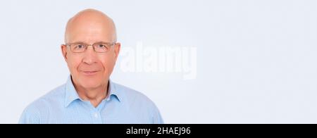 Close-up portrait of senior man looking at camera. Studio shot, wide image with copy space Stock Photo