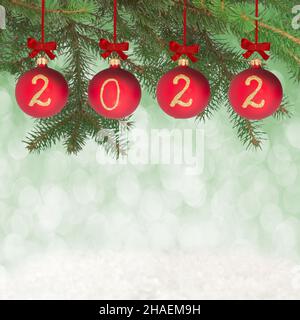 2022 New year text on christmas baubles Stock Photo