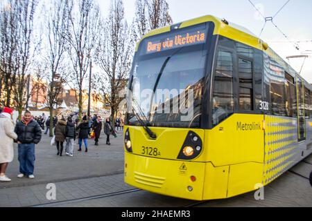 MANCHESTER, ENGLAND- 27 November 2021: Tram on New York Street in Manchester, England Stock Photo