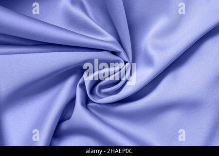 Fabric twisted in soft spiral, fashion lavender blue color, modern background Stock Photo