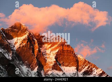 evening view of Lhotse and clouds on the top, warm tone - way to mount Everest base camp, khumbu valley, Nepal Stock Photo