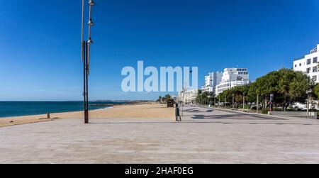 The promenade that connects the Algarve towns of Quarteira and Vilamoura in Portugal. Stock Photo