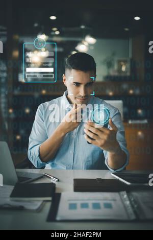 A businessman using face scan to cyber security for his saving account, business, technology and future Concept. Stock Photo