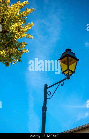 single street lamp against the blue sky in France Stock Photo