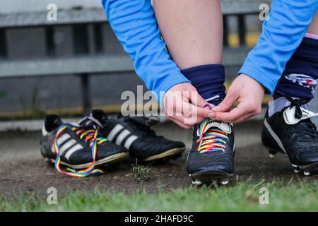 Rainbow Laces being tied up on football boots Stock Photo