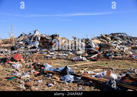 Dawson Springs, United States. 12th Dec, 2021. Debris are piled after a tornado tore through rural Kentucky.Multiple tornadoes touched down in several midwestern states late Friday evening causing widespread destruction and leaving an estimated 70-plus people dead. Credit: SOPA Images Limited/Alamy Live News Stock Photo