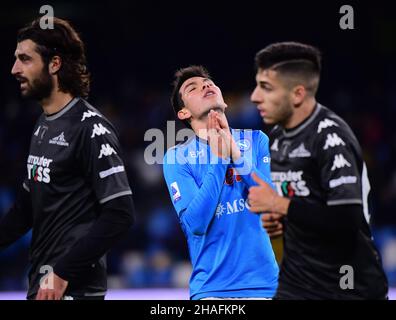 Naples. 12th Dec, 2021. Napoli's Hirving Lozano (C) reacts during a Serie A football match between Napoli and Empoli in Naples, Italy, on Dec.12, 2021. Credit: Alberto Lingria/Xinhua/Alamy Live News Stock Photo