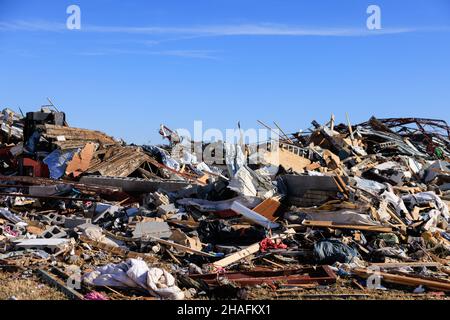 Dawson Springs, United States. 12th Dec, 2021. Debris are piled after a tornado tore through rural Kentucky.Multiple tornadoes touched down in several midwestern states late Friday evening causing widespread destruction and leaving an estimated 70-plus people dead. (Photo by Jeremy Hogan/SOPA Images/Sipa USA) Credit: Sipa USA/Alamy Live News Stock Photo