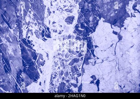 Marble nature texture made as if performed by fluid art technique. The drawing includes swirls of marble. Trendy color of 2022. Stock Photo