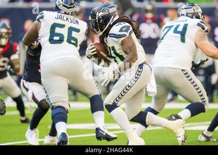 HOUSTON, TX - DECEMBER 12: Seattle Seahawks DE Darrell Taylor watches  action during game featuring the Houston Texans and the Seattle Seahawks on  December 12, 2021 at NRG Stadium in Houston, TX. (