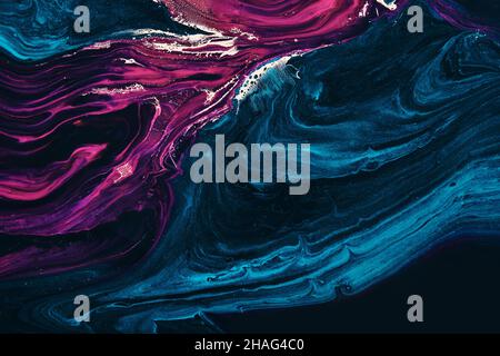 Fluid Art. Metallic Gold in abstract blue and purple wave. Marble effect background or texture Stock Photo