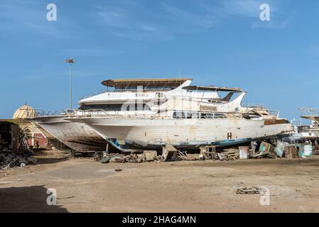 Hurghada, Egypt - May 31, 2021: Old recreational sea boats under repair in the shipyard of Hurghada, Egypt. Stock Photo