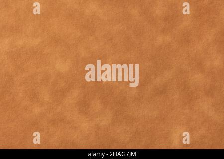 Texture of light brown old paper, crumpled background. Vintage beige grunge surface backdrop. Structure of craft parchment cardboard. Velvet matt text Stock Photo
