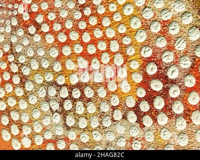 Abstract art background white and red color. Multicolor gouache painting on canvas with orange spotted pattern. Fragment of artwork. Texture stucco ba Stock Photo