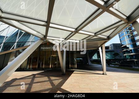 The iconic Standard Chartered bank building at the Exchange square in the Central District of Hong Kong. Stock Photo