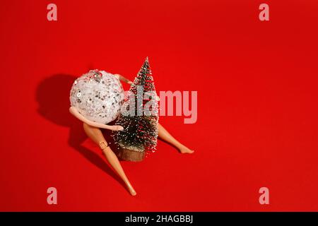 modern makeup doll face portrait toy red hair girl lying in green  background Stock Photo - Alamy