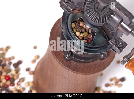 Old style pepper mill isolated on white background Stock Photo