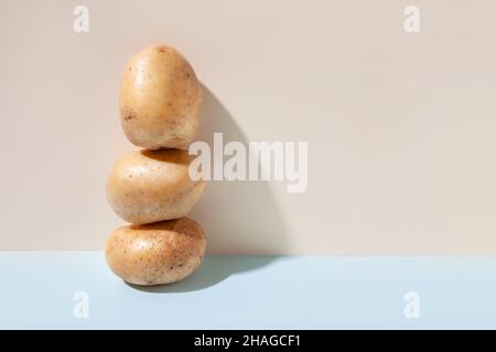 Potato tubers in milk. The concept of vegetables. Stock Photo