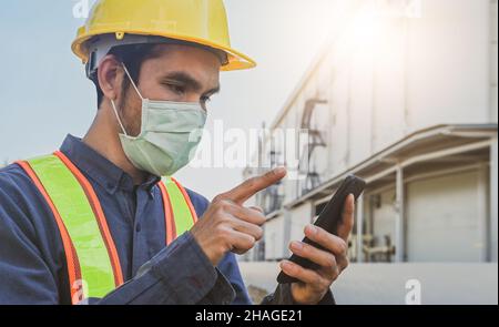 Engineer holding smartphone send message internet technology , Engineer construction inspection building project Stock Photo