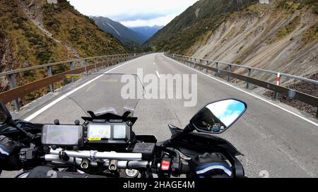 Motorcyclist crossing the Otira Viaduct on Arthur's pass - South Island New Zealand Stock Photo