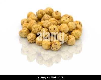 Roasted chickpeas macro shot on white. selected Focus on foreground. isolated background turkish traditional product nuts roasted chickpeas Stock Photo