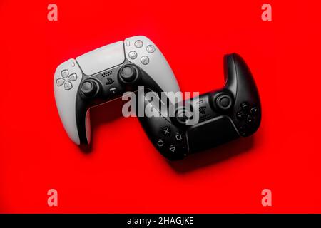 Ukraine - December 10, 2021. Wireless PlayStation 5 Dualsense gamepads. Stock Photo