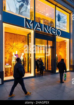 Shop window of MANGO, a popular fashion store in Oxford St, London, approaching Christmas, at night Stock Photo