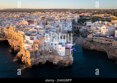 Aerial view of the overhanging houses of Polignano a Mare at sunrise. Bari district, Apulia, Italy, Europe. Stock Photo