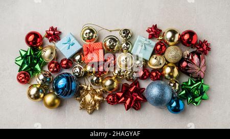 Bright Christmas composition of spruce red & gold Christmas decorations on white background. Winter holidays, New Year. Stock Photo