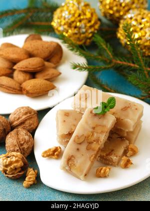 Turrón de mazapán y nueces. Marzipan nougat with walnuts. Typical dessert from Spain for Christmas. Stock Photo