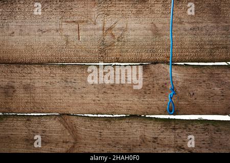 Heart with initials carved in horizontal wood panels. Stock Photo