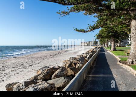 Iconic Glenelg Beach Esplanade on a bright summer day. The jetty can be seen in the background, South Australia Stock Photo