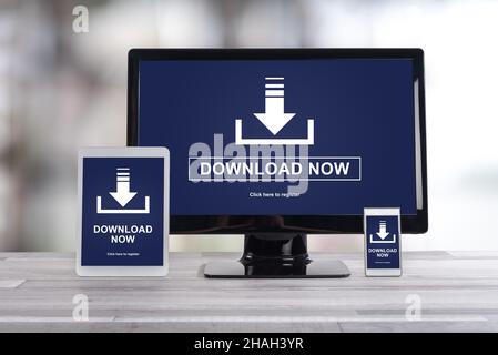 Download concept shown on different information technology devices Stock Photo