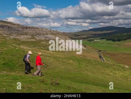 Walking above Kingsdale in The Yorkshire Dales Stock Photo