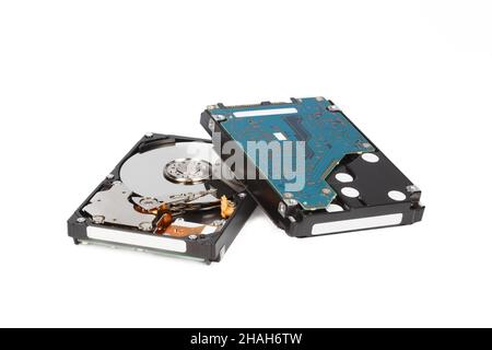 Two hard drives, front and back sides, on a white background close-up Stock Photo