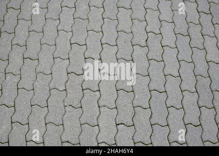 Same stone paving slabs laid out in rows in full frame Stock Photo