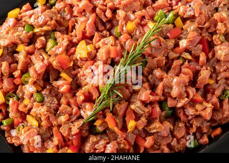 raw sauced diced meat on white wood background. Meat background. Meat close-up. Local name dana tantuni Stock Photo