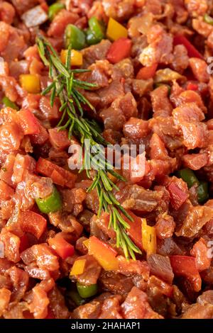 raw sauced diced meat on white wood background. Meat background. Meat close-up. Local name dana tantuni Stock Photo