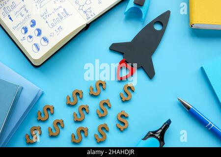 Startup concept. Spaceship as a new business on the table. Stock Photo