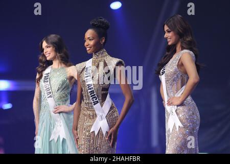 (211213) -- EILAT, Dec. 13, 2021 (Xinhua) -- Indian contestant Harnaaz Sandhu, South African contestant Lalela Mswane and Paraguayan contestant Nadia Ferreira (from R to L) participate in the 70th Miss Universe in southern Israeli city of Eilat on Dec. 13, 2021. Miss India Harnaaz Sandhu was crowned as the 70th Miss Universe at the pageant held on the night between Sunday and Monday at Israel's southernmost resort city of Eilat. Sandhu, a 21-year-old actress and model, beat 79 other contestants and won a third title for her country, following previous Indian wins in 1994 and 2000. She was cr Stock Photo