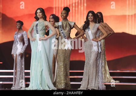 (211213) -- EILAT, Dec. 13, 2021 (Xinhua) -- Indian contestant Harnaaz Sandhu, South African contestant Lalela Mswane and Paraguayan contestant Nadia Ferreira (from R to L, front) participate in the 70th Miss Universe in southern Israeli city of Eilat on Dec. 13, 2021. Miss India Harnaaz Sandhu was crowned as the 70th Miss Universe at the pageant held on the night between Sunday and Monday at Israel's southernmost resort city of Eilat. Sandhu, a 21-year-old actress and model, beat 79 other contestants and won a third title for her country, following previous Indian wins in 1994 and 2000. She Stock Photo