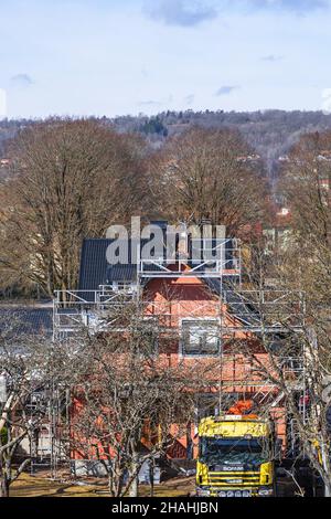 Roofing on a roof with scaffolding Stock Photo