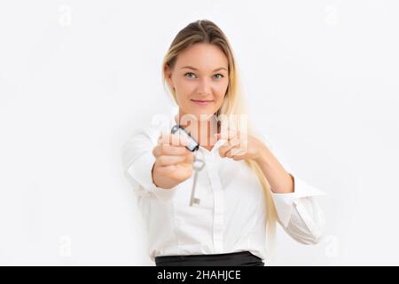 Young nordic blonde woman showing house keys Stock Photo