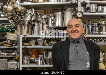 Saint-Chamond, France. Kader Zennaf collects aluminum objects in his late mother's house. He started doing this at an early age. As a child, he was given a small coffee mug made of aluminum, the French metal. Stock Photo