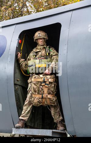 13 November 2021, London, UK - Lord Mayor's Show, 4th Battalion Army Reserve Parachute Regiment soldier standinf in the door of a mock airplane Stock Photo