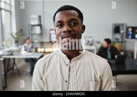 Close-up of African young manager looking at camera while working at office Stock Photo